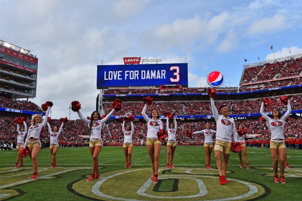 The San Francisco 49ers cheer squad performs on the field as the scoreboard displays support for Buffalo Bills Damar Hamlin before their NFL game at Levi's Stadium in Santa Clara, Calif., on Sunday, Jan. 8, 2023. (Jose Carlos Fajardo/Bay Area News Group)
