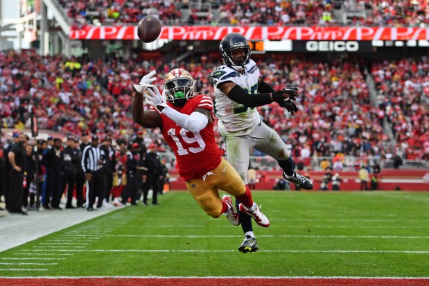 San Francisco 49ers' Deebo Samuel (19) fails to catch a touchdown pass in front of Seattle Seahawks' Michael Jackson (30) in the second quarter of their NFC wild-card playoff game at Levi's Stadium in Santa Clara, Calif., on Saturday, Jan. 14, 2023. (Jose Carlos Fajardo/Bay Area News Group)