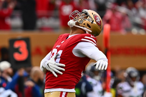 San Francisco 49ers' Arik Armstead (91) reacts after sacking Seattle Seahawks quarterback Geno Smith (7) in the first quarter of their NFC wild-card playoff game at Levi's Stadium in Santa Clara, Calif., on Saturday, Jan. 14, 2023. (Jose Carlos Fajardo/Bay Area News Group)