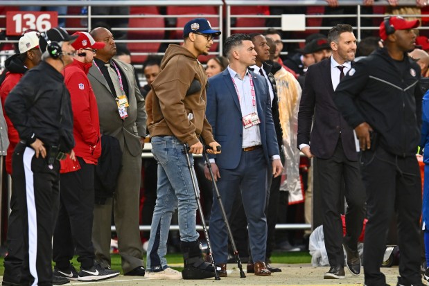 San Francisco 49ers quarterback Trey Lance (5) walks with crutches on the sideline during their NFC wild-card playoff game at Levi's Stadium in Santa Clara, Calif., on Saturday, Jan. 14, 2023. The San Francisco 49ers defeated the Seattle Seahawks 41-23. (Jose Carlos Fajardo/Bay Area News Group)