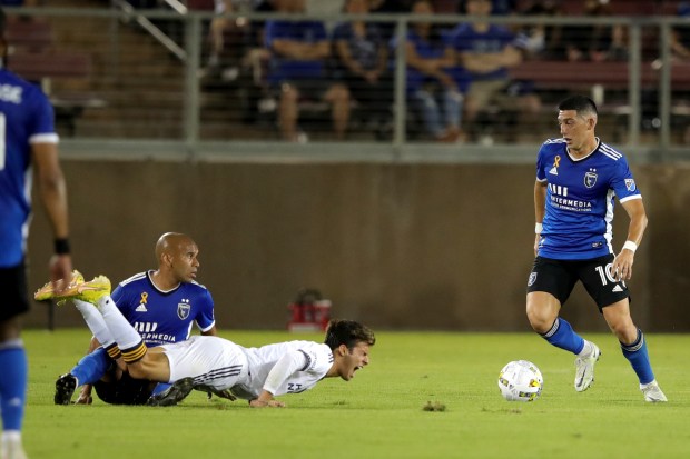 STANFORD, CALIFORNIA - SEPTEMBER 24: LA Galaxy's Ricard Puig (6) is fouled by San Jose Earthquakes' Judson (93) in the first half of their MLS California Clasico at Stanford Stadium in Stanford, Calif., on Saturday, Sept. 24, 2022. (Ray Chavez/Bay Area News Group)