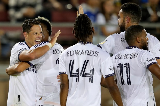 STANFORD, CALIFORNIA - SEPTEMBER 24: LA Galaxy's Javier Hernández (14) is congratulated by teammates after he scored his second goal against the San Jose Earthquakes goalkeeper JT Marcinkowski (1) in the second half of their MLS California Clasico soccer match at Stanford Stadium in Stanford, Calif., on Saturday, Sept. 24, 2022. (Ray Chavez/Bay Area News Group)