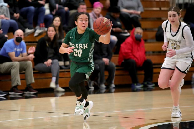 Sacred Heart Cathedral's Reza Poe (20) drives to the hoop on a fastbreak against Archbishop Mitty's Elle Hanson (23) during a West Catholic Athletic League basketball game at Archbishop Mitty High in San Jose, Calif., on Wednesday, Jan. 11, 2023. (Ray Chavez/Bay Area News Group)