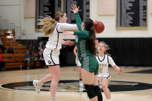 Archbishop Mitty's Elle Hanson (23) steals pass intended to Sacred Heart Cathedral's Leilani Blecha (3) during a West Catholic Athletic League basketball game at Archbishop Mitty High in San Jose, Calif., on Wednesday, Jan. 11, 2023. (Ray Chavez/Bay Area News Group)