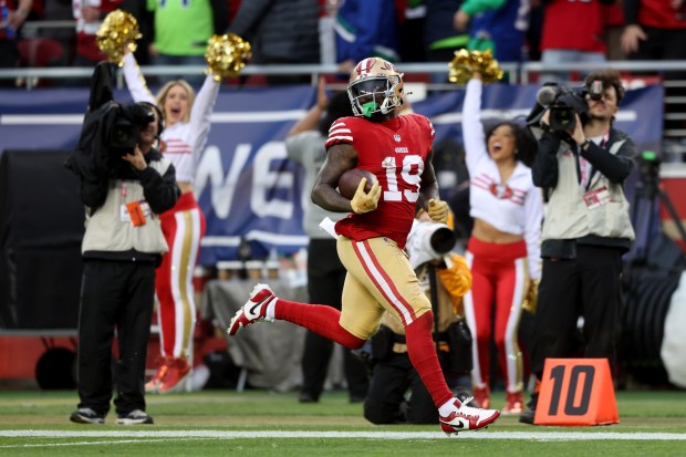 San Francisco 49ers' Deebo Samuel (19) breaks free on a 74-yard touchdown play in the fourth quarter of their NFC wild-card playoff game against the Seattle Seahawks, Saturday, Jan. 14, 2023, at Levi's Stadium in Santa Clara, Calif. (Karl Mondon/Bay Area News Group)