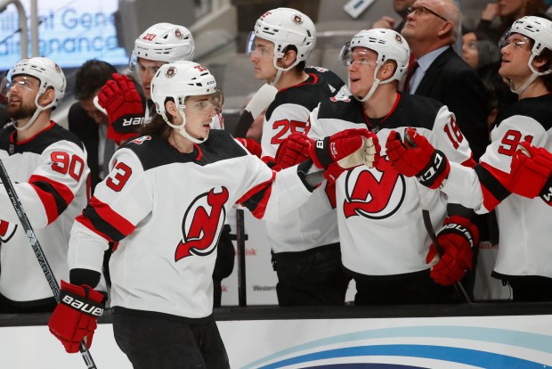 New Jersey Devils defenseman Ryan Graves (33) celebrates with the bench after scoring in the first period of an NHL hockey game against the San Jose Sharks, Monday, Jan. 16, 2023, in San Jose, Calif. (AP Photo/Josie Lepe)