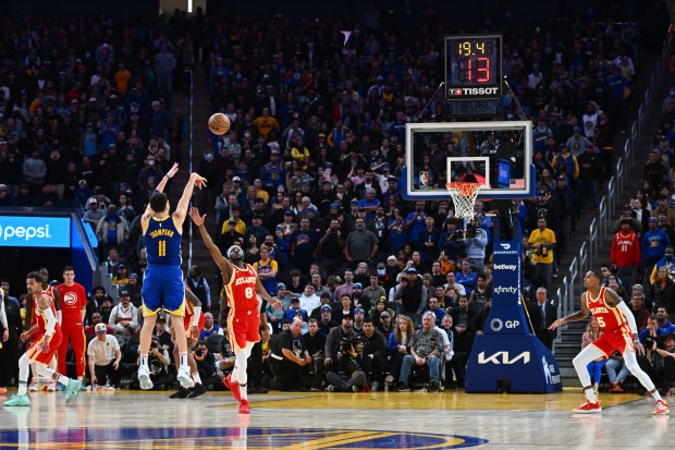 Golden State Warriors' Klay Thompson (11) shoots and makes a three-point basket during overtime of their NBA game at the Chase Center in San Francisco, Calif., on Monday, Jan. 2, 2023. Thompson's basket would send the game into double overtime. The Golden State Warriors defeated the Atlanta Hawks 143-141 in double overtime. (Jose Carlos Fajardo/Bay Area News Group)