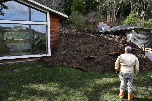 Pat Daly, of Berkeley, glances up at the damage caused to his house on Middlefield Road after a mudslide in Berkeley, Calif., on Monday, Jan. 15, 2023. (Jose Carlos Fajardo/Bay Area News Group)