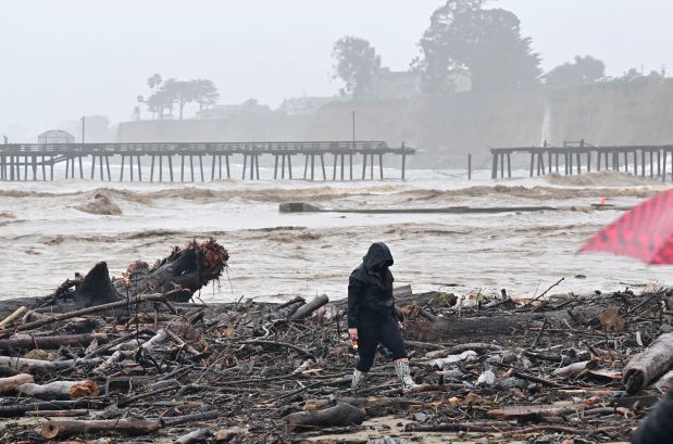 The pier at Capitola Wharf is seen split in half from Aptos, California on January 9, 2023. - A massive storm called a "bomb cyclone" by meteorologists has arrived and is expected to cause widespread flooding throughout the state. (Photo by JOSH EDELSON / AFP) (Photo by JOSH EDELSON/AFP via Getty Images)