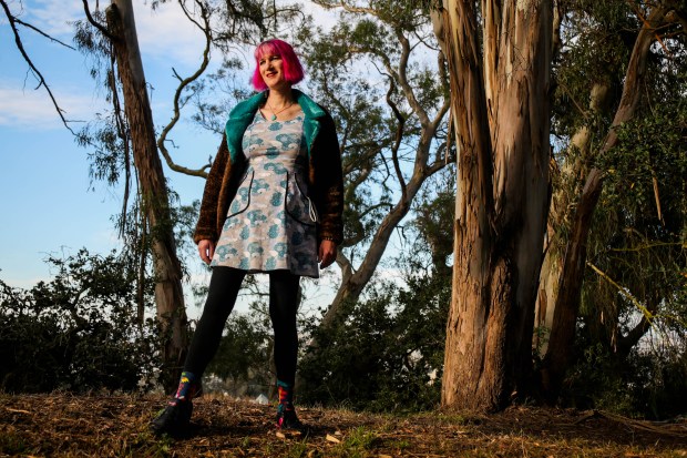 Charlie Jane Anders, a sci-fi author who has a new trilogy about space, teens and fascist regimes, stands at Buena Vista Park in San Francisco.