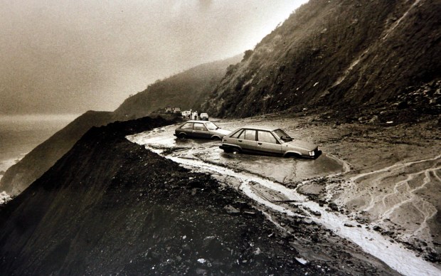 Vehicles get trapped in a mud slide on Highway 1 just south of Esalen on Feb. 13, 1987. The major winter storm caused this section of roadway to be closed for weeks. (Monterey Herald Archives)