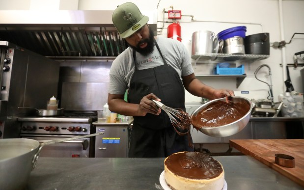 OAKLAND, CALIFORNIA - JANUARY 10: Charles Farrier, owner of the bake shop Crumble and Whisk works on a cheesecake in his kitchen on Tuesday, Jan. 10, 2023 in Oakland, Calif. (Aric Crabb/Bay Area News Group)