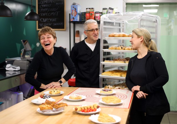 WALNUT CREEK, CALIFORNIA - JANUARY 11: Rica Zaharia, left, laughs with her brother Dan Petcu, center, and baker Vida M, right, at the European Delights Bakery on Wednesday, Jan. 11, 2023, in Walnut Creek, Calif. Rica Zaharia is a self-taught Romanian baker who with her husband, Sorin Zaharia, and brother, Dan Petcu, owns European Delights. (Aric Crabb/Bay Area News Group)