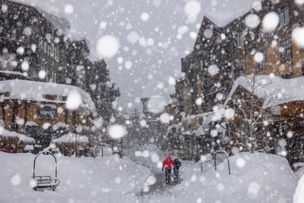 In this photo provided by Mammoth Lakes Tourism heavy snow falls in Mammoth Lakes, Calif. on Monday, Jan. 9, 2023. (Patrick Griley/Mammoth Lakes Tourism via AP)