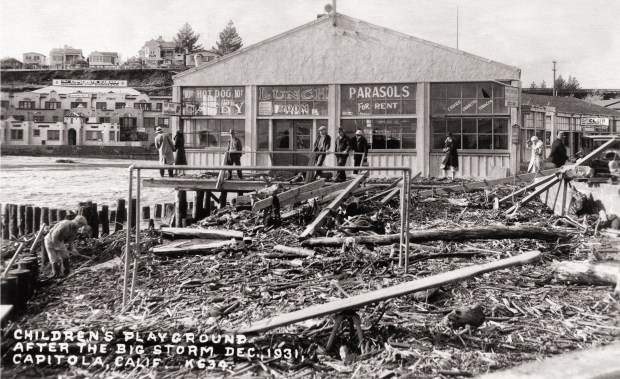 A playground was washed off the Capitola waterfront in a 1931 storm, revealing a wooden platform built in the 1920's holding up oceanside businesses. The platform is believed to be the same structure that holds several Capitola Village restaurants over the water and was significantly damaged in the Jan. 5, 2023 storm. (courtesy of Capitola Historical Museum)