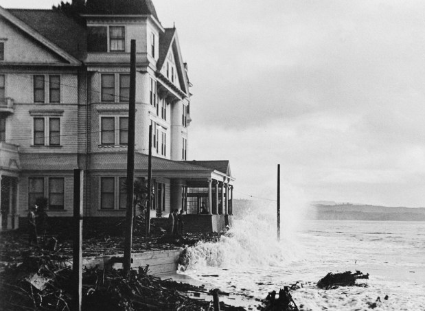 Hotel Capitola, completed in 1895, gets slammed by a wave in a 1926 storm. The 160-room resort structure burned to the ground three years later. (courtesy of Capitola Historical Museum)