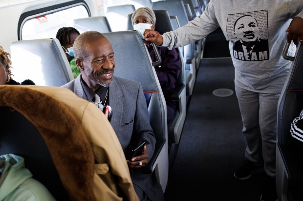 Passenger Patrice Gartley of Salinas talks with fellow passengers while riding the Caltrain NorcalMLK Celebration Train to San Francisco during Dr. Martin Luther King Jr. Day on Jan. 16, 2023. (Dai Sugano/Bay Area News Group)