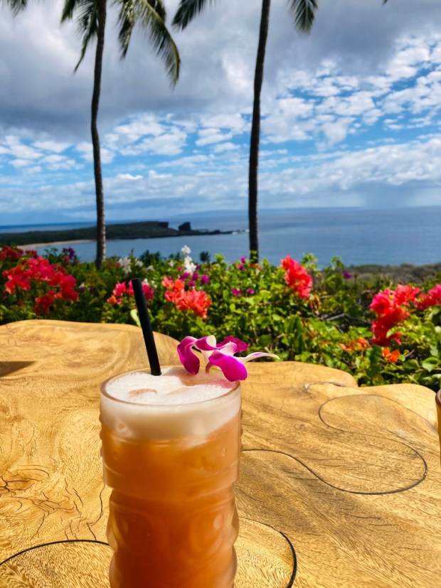 Rum concoctions like the Hulopo'e Punch are de rigueur at Views, one of five restaurants in Larry Ellison's Four Seasons Resort Lanai. Ellison owns two Four Seasons hotels on the tiny island. (Courtesy Peter Delevett)