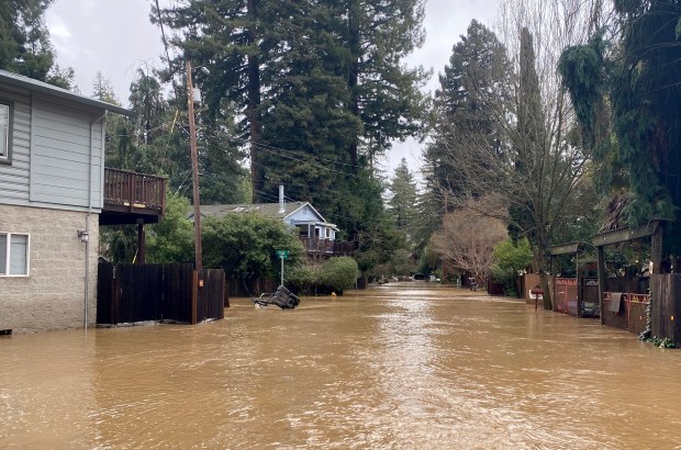 Floodwaters filled a Felton neighborhood in Santa Cruz County for a second time in less than a week after heavy rains from a series of atmospheric river storms swelled the San Lorenzo River above flood stage Sat. Jan. 14, 2023. (John Woolfolk/Bay Area News Group)