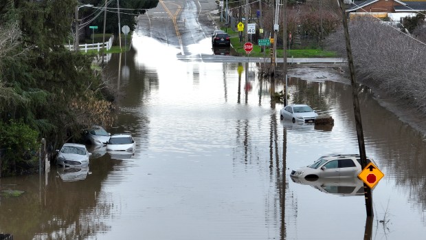 Floodwaters submerge parked vehicles on January 11, 2023 in Planada, California. (Photo by Justin Sullivan/Getty Images)