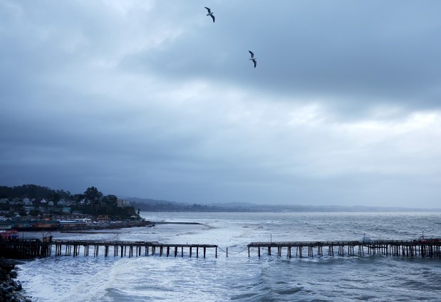 Gulls fly above above a storm-damaged pier on January 10, 2023 in Capitola, California. (Photo by Mario Tama/Getty Images)
