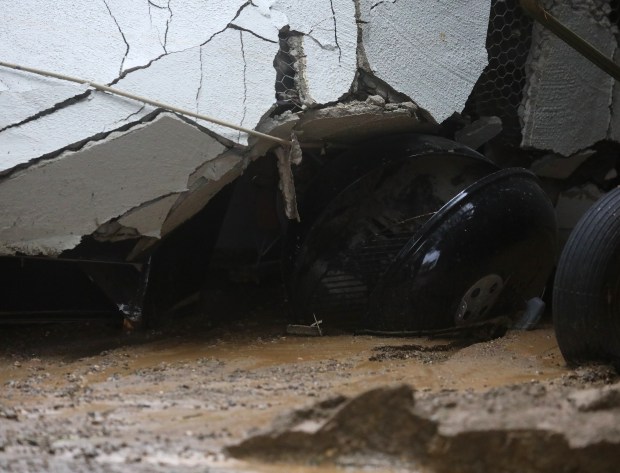 HAYWARD, CALIFORNIA - JANUARY15: A bbq crushed by the wall of a home along Faircliff Street on Sunday, Jan. 15, 2023, in Hayward, Calif. A mud slide occurred on Saturday afternoon and left the residence uninhabitable. (Aric Crabb/Bay Area News Group)