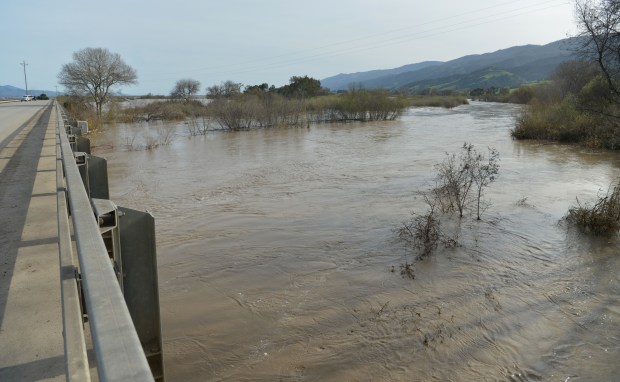 The high waters of the Salinas River flow under a bridge on Chualar Road near Chualar, Calif., on Friday, Sept. 17, 2022. The Monterey County Sheriff's Office ordered additional evacuations for low-lying areas along the Salinas River in preparation of floods that could potentially close overland routes. (Doug Duran/Bay Area News Group)
