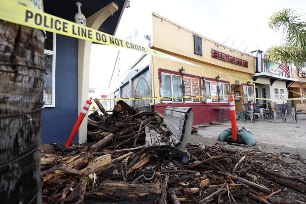 Debris is seen piled up in front of a restaurant following a massive storm that hit the area on January 06, 2023 in Capitola, California. A powerful storm pounded the West Coast this weeks that uprooted trees and cut power for tens of thousands on the heels of record rainfall over the weekend. (Photo by Justin Sullivan/Getty Images)